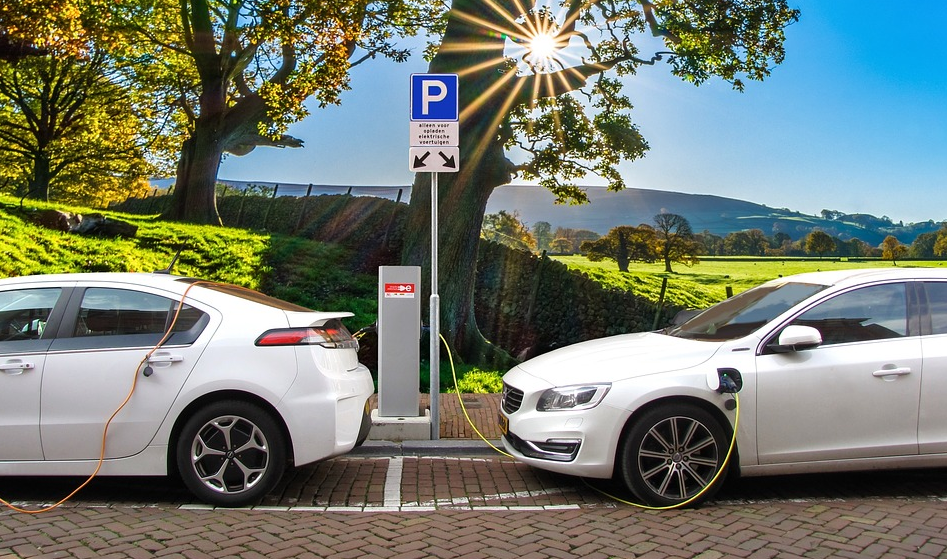 two electric cars charging